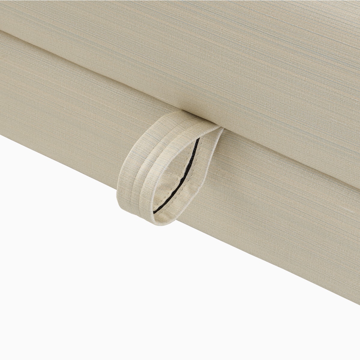 A close-up view of a pull tab on the Gemma Sleep Chair.