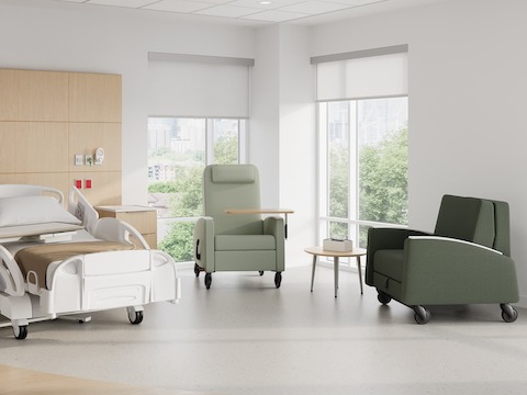 Gemma Recliner, Gemma Sleep Chair and Mora System in a patient room. Featuring Gemma Recliner with adjustable tray table, and both Gemma products with CBS casters.