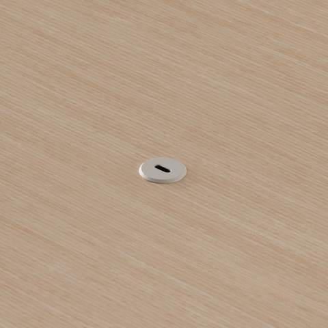 Close view of the Ello Micro Direct USB-C single port embedded in a Headway table surface.