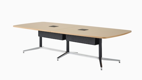 A large boat-shape, Y-base Headway Conference Table with a light wood top, black fabric tech hammock, and black base viewed at a 45-degree angle.