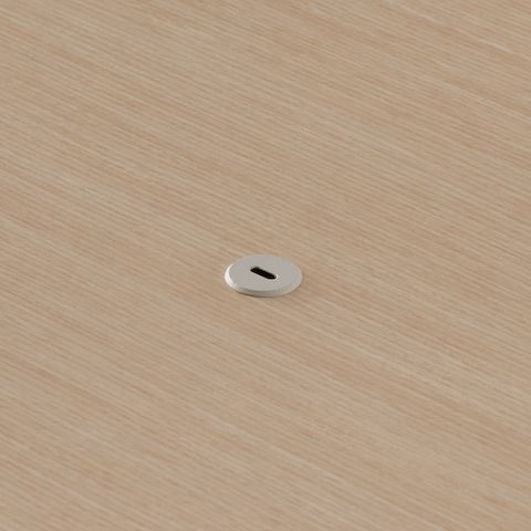 Close view of the Ello Micro Direct USB-C single port embedded in a Headway table surface.