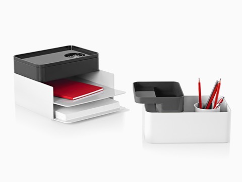 Two configurations of Formwork stackable desktop storage items, including paper trays, large and small boxes, and a pencil cup.