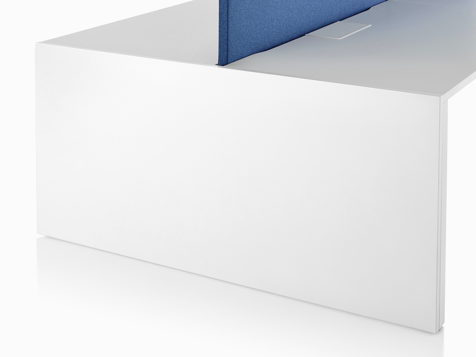 Close-up of the white laminate gallery panel at the end of run on a Layout Studio bench.