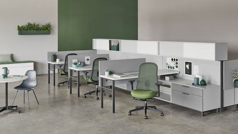 Black and green Lino Chairs with adjustable sacral lumbar support, paired with Canvas Wall workstations.