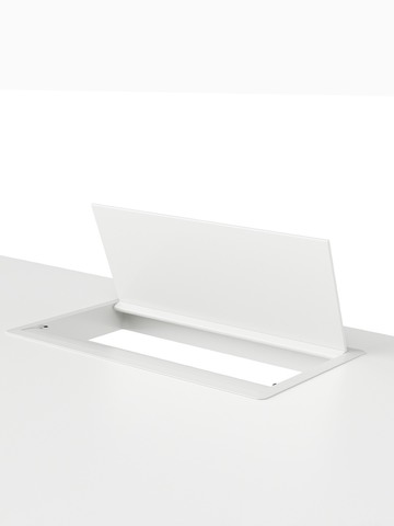 A grommet-mounted desktop power port.