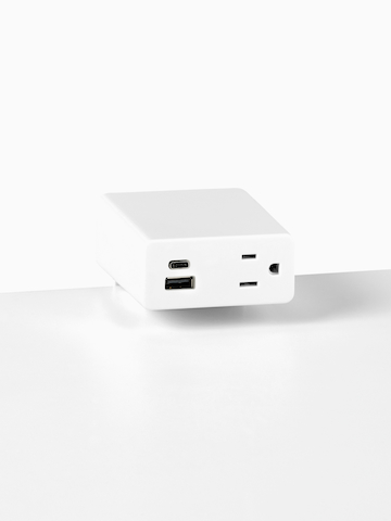 Close up image of a white surface mounted Logic Mini with two USB ports and one simplex receptacle.