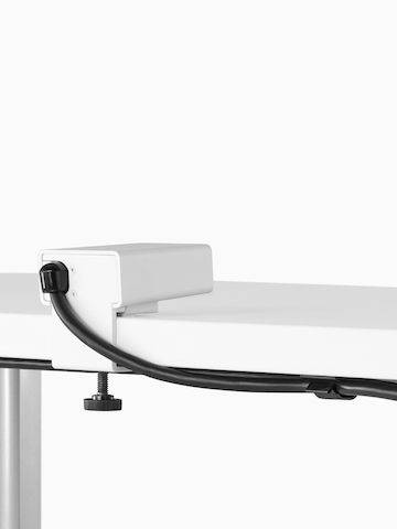 A small, surface-mounted desktop power port. Select to go to the Logic Mini Vine product page.