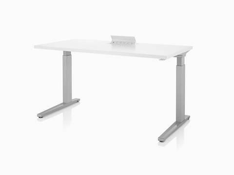 Logic power source with USB-A port, USB-C port, and five A/C power outlets embedded into white height adjustable table.