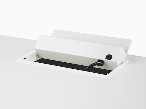 A grommet-mounted Logic power port tilted back to reveal the main power cord connection.