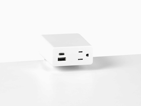 Close up image of a white surface mounted Logic Mini with two USB ports and one simplex receptacle.