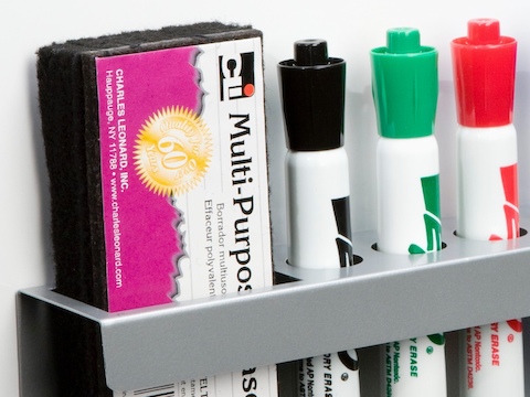 A Marker/Eraser Holder containing dry-erase markers and an eraser.