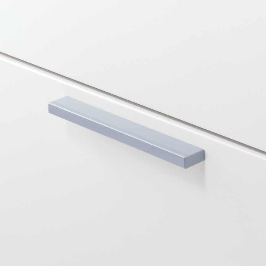 Close up image of a silver bar pull on a white Meridian Storage case.