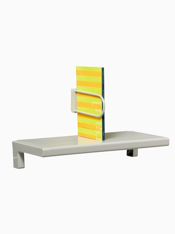 A small shelf holds an upright catalog. Select to go to the Mini-Shelf product page.