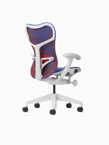 Rear angle view of a Mirra 2 chair with a Butterfly back in ultramarine color-block and alpine frame.