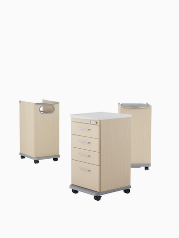 Three Mora casework carts, including a supply cart, linen cart, and trash cart in a light ash finish.
