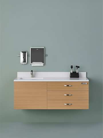 Wall-mounted Mora System casework consisting of three drawers and an integral sink and backsplash.