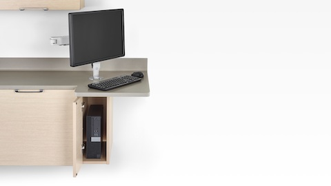 Technology support available with the Mora clinical casework system, including a CPU cabinet and monitor arm.