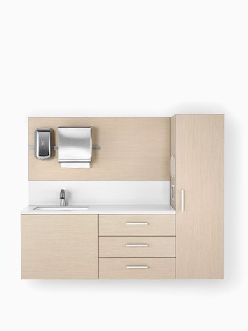 Mora System casework in an ash finish with a white solid surface and integrated sink.