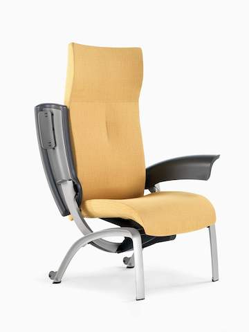 Angled view of a mustard-coloured Nala Patient Chair with one arm pivoted back for easier patient access.