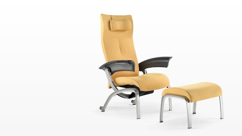 A mustard-coloured Nala Patient Chair and ottoman, viewed from a 45-degree angle.