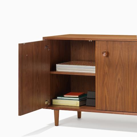 Nelson Basic Credenza in walnut, taper legs, cupcake pulls, two doors and four drawers.