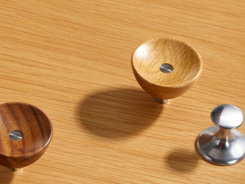 Nelson Basic Cabinet Series pawn pull, wavy pull, oak cupcake pull, and walnut cupcake pull.