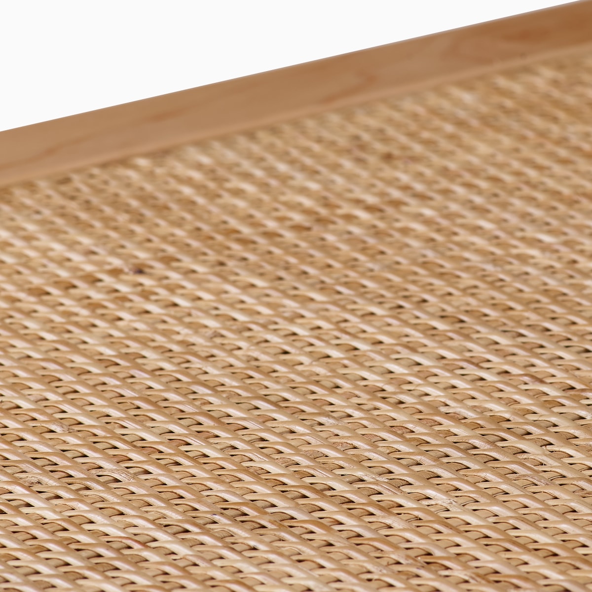 Close up detail of the cane top of a Nelson Cane Bench.