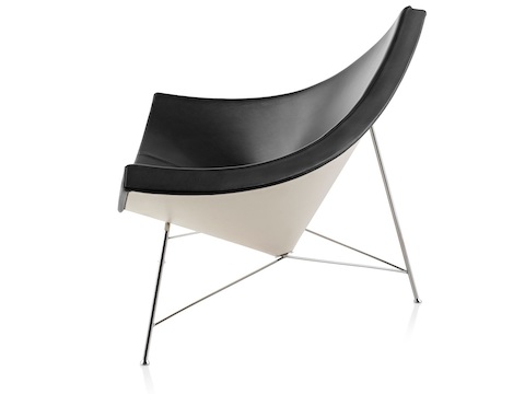 Profile view of a black leather Nelson Coconut Lounge Chair. 