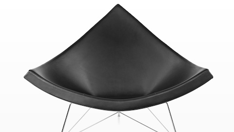 Close view of a black leather Nelson Coconut Lounge Chair, highlighting its resemblance to a chunk of coconut.