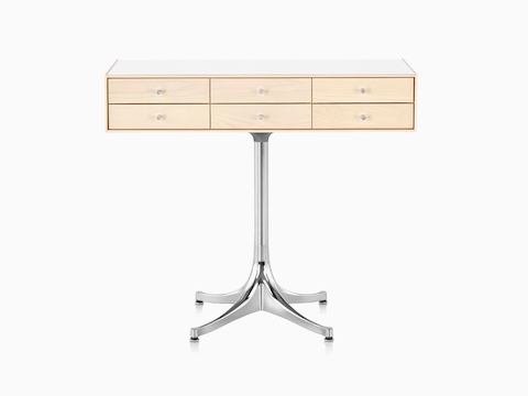 A horizontal six-drawer Nelson Miniature Chest with a light finish, white top, and polished aluminum pedestal base. 