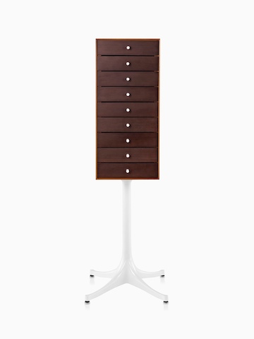 A vertical nine-drawer Nelson Miniature Chest with a dark finish and white pedestal base. 