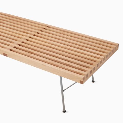 A close up detail of the Nelson Platform Bench highlighting the solid wood slats.
