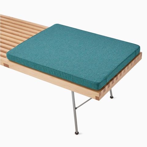 A close up detail of the Nelson Platform Bench highlighting the optional cushion.