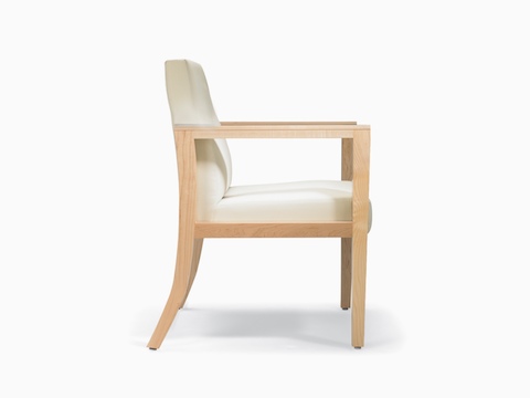 A side view of a Brava 863 Chair with maple frame and white textile.