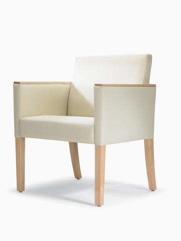 A three-quarter view of a Brava 862 Chair with maple frame, maple arm caps, and white textile.