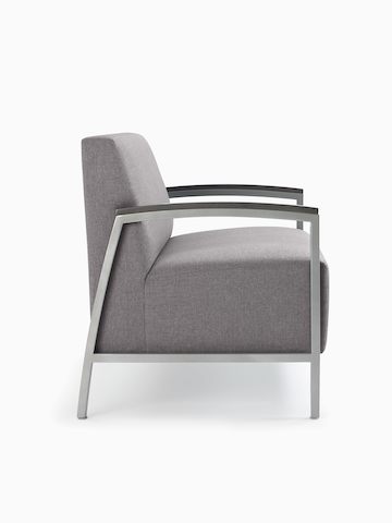 Side view of a gray Brava Lounge Seating chair with wood arm caps.