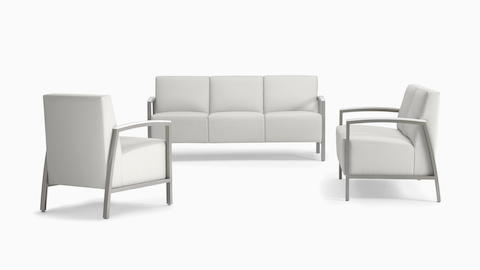 A trio of Brava Modern Lounge Seating consisting of one chair, a two seat, and three seat, all with solid surface arm caps.