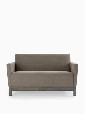 Front view of a gray Brava Platform Lounge System two-seat sofa with upholstered arms on a wood base.