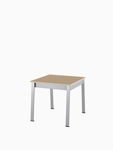 Angled view of an Easton Side Table with a clear on ash laminate top and metallic silver legs.