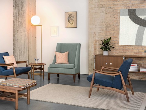 A waiting area featuring two Nemschoff Aspen Lounge Chairs, a Nemschoff Iris Lounge Chair, and a Nemschoff Tamarack Table and Bench.