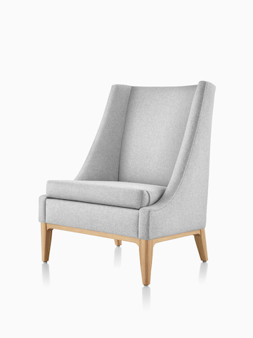 Angled front view of an Iris Lounge Chair in a light gray textile with an oak base. Select to go to the Nemschoff Iris Lounge Chair product page.
