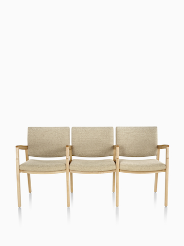 Monarch Multiple Seating three-seater with intervening arms and legs in tan textile with solid hardwood frame and wood arm caps.