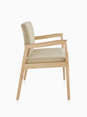 A side view of Monarch Plus Chair in tan textile with solid hardwood frame and wood arm caps.