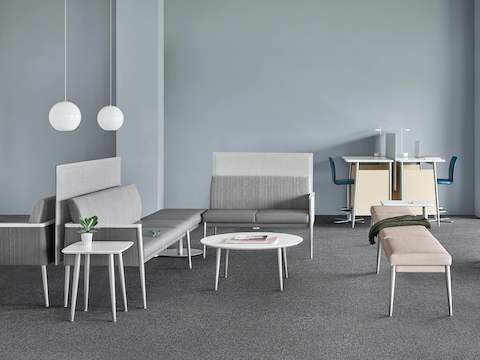 A healthcare waiting area featuring featuring Palisade Multiple Seating in gray textiles and Palisade Bench in tan.