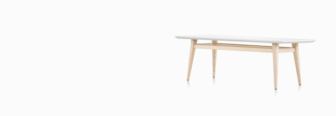 Palisade Coffee Table with wood legs and white solid surface top.