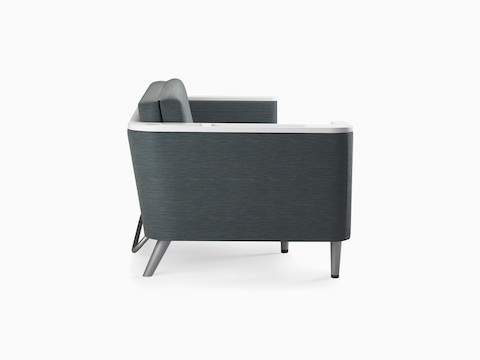 A Nemschoff Palisade Flop Sofa in dark gray textile with white solid surface arms caps, viewed from the side.