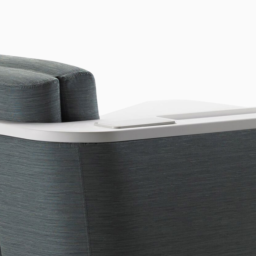 Detail of the back of Nemschoff Palisade Flop Sofa showing the solid surface arm and back cap.