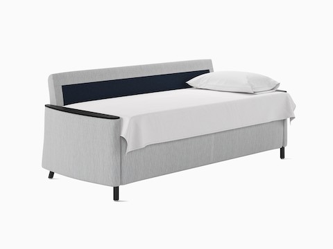 A Pamona Flop Sofa converted to sleep surface in light gray textile.