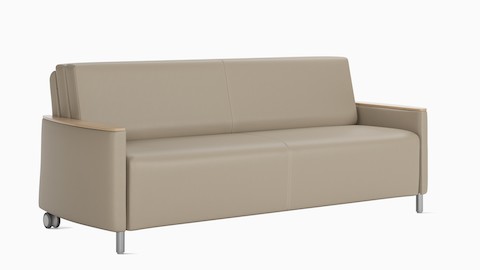 A Pamona Flop Sofa in beige textile with 2 locking casters, viewed at an angle.