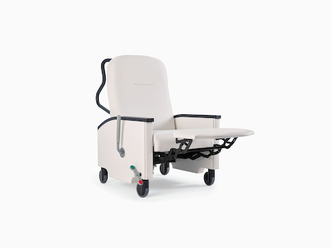 Nemschoff Pristo Recliner in a white upholstery with black arm caps and wheels, with the footrest extended out.